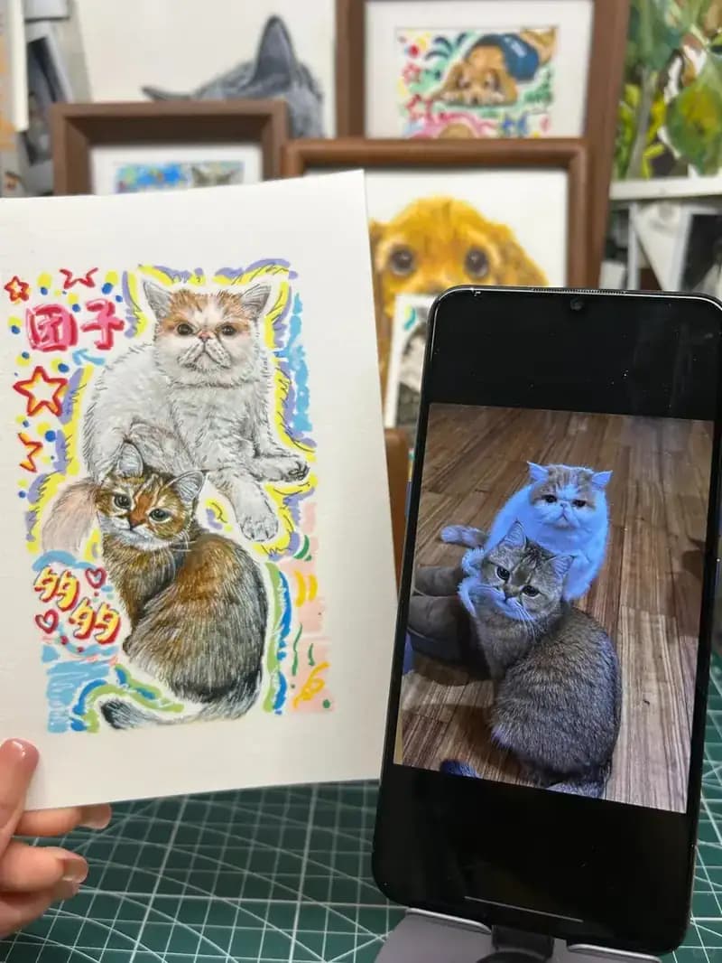 Hand-drawn cat portrait compared with the phone photo used as reference, showing how a good portrait captures the original